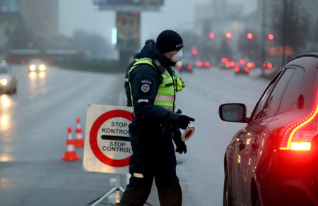 In Lithuania, the police have begun to restrict movement between municipalities, and the police check residents' documents when entering cities. Pandemic outbreak. 18 12 2020のeditorial素材
