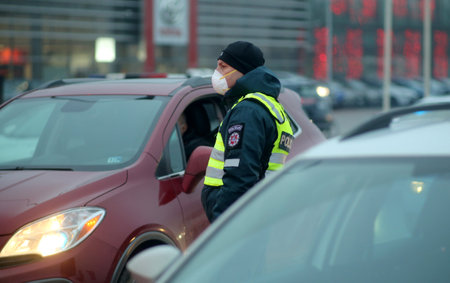 In Lithuania, the police have begun to restrict movement between municipalities, and the police check residents' documents when entering cities. Pandemic outbreak. 18 12 2020のeditorial素材