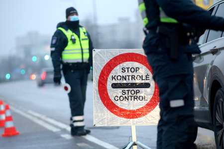 In Lithuania, the police have begun to restrict movement between municipalities, and the police check residents' documents when entering cities. Pandemic outbreak. 18 12 2020のeditorial素材