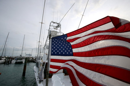 American flag waving against a cloudy sky. USAのeditorial素材
