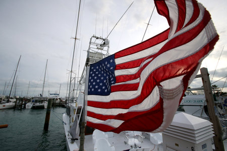American flag waving against a cloudy sky. USAのeditorial素材