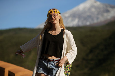 Woman walking in mountains enjoying beautiful landscape and feeling freedom and happiness. Mount Teideの写真素材