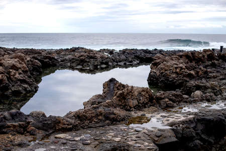 View of Natural sea pool Las Salinas de Agaete in Puerto de Las Nieves and coast cliffs. Gran Canaria, Spainの写真素材