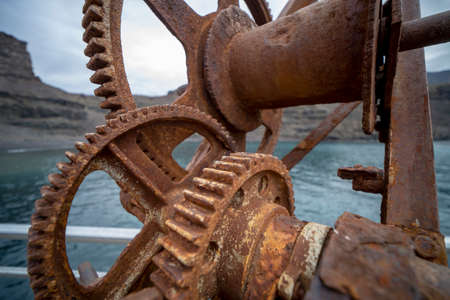 Details of a parts the moving parts of a rusty machine mechanical gearの写真素材
