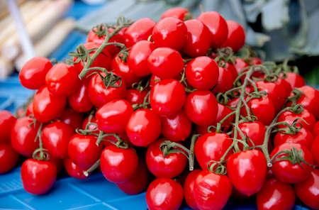 Red tomatoes at vegetables market.の写真素材