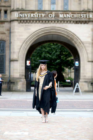 Portrait of a happy woman on her graduation day at university. Education and people.の写真素材