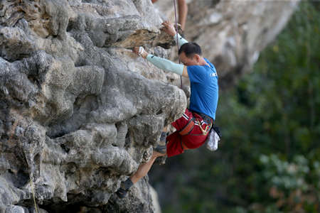 Mountaineers exercise rock climbing at Beach Bay in Krabi, Thailand 03 12 2019