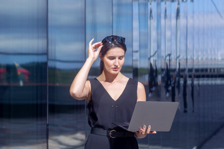 Business woman work on laptop computer at outdoor