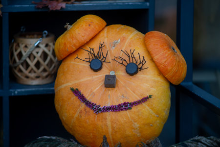 Decorating autumn pumpkins at home. Traditional Thanksgiving and Halloween decor. Goods of the autumnの写真素材