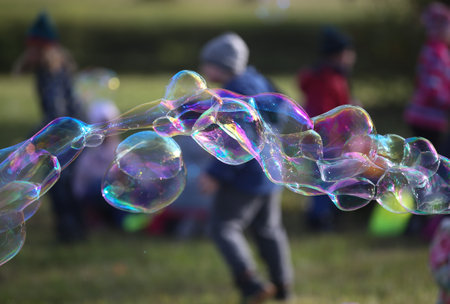 Soap bubbles in nature as a background blurの写真素材