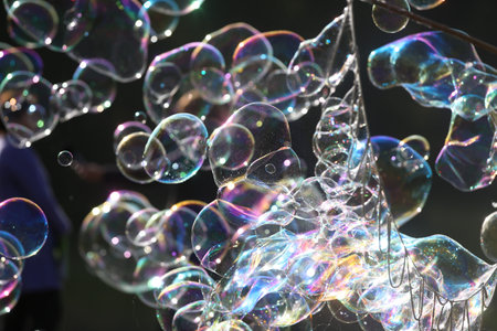 Soap bubbles in nature as a background blurの写真素材