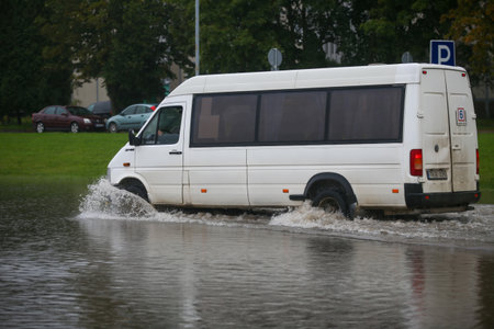 Flooded cars on the street of the city. Street after heavy rain. Water could enter the engine, transmission parts or other places. Disaster Motor Vehicle Insurance Claim Themed. Severe weather concept 09 21 2017のeditorial素材