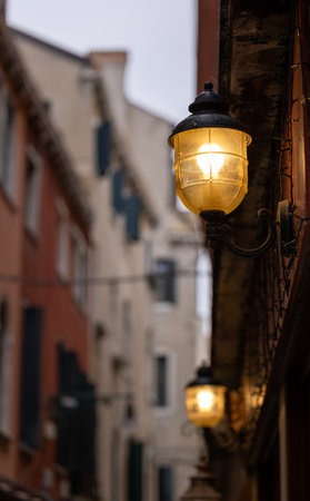 Old wall street lighting, in the old town, Venice, Italyの写真素材