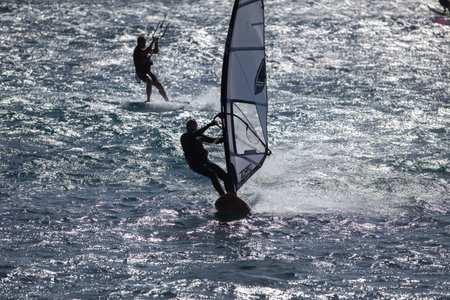 Windsurfers in windy weather on the coast of the island of Tenerife 01 08 2022の写真素材