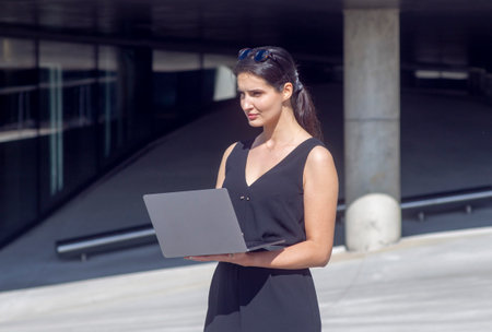 Business woman work on laptop computer at outdoorの写真素材