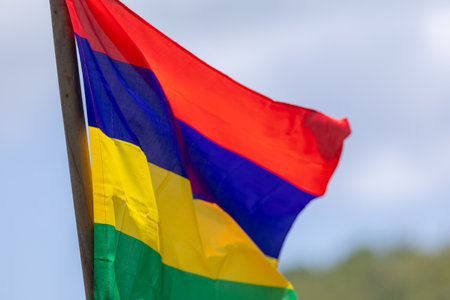 The national flag of Mauritius flutters on the lawnの写真素材