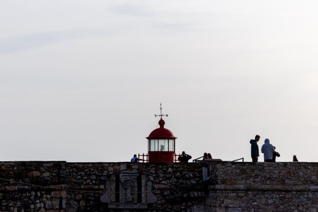 The famous red lighthouse of Nazar, the place further to the west of Europe (Portugal)の写真素材