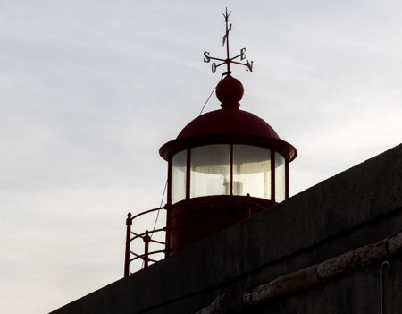 The famous red lighthouse of Nazar, the place further to the west of Europe (Portugal)の写真素材