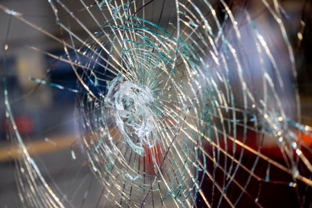 Traces of Vandalism: Shattered Shop Window in a Remote Street, Attempted Robbery, glass package