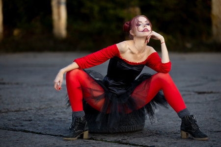 Fun and Beautiful: Portrait of a Young Redhead Ready for Halloweenの写真素材