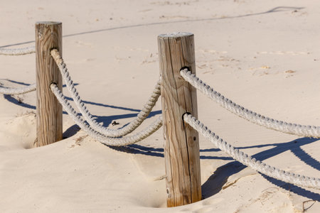 A rope marked seaside path in the sand dunesの写真素材