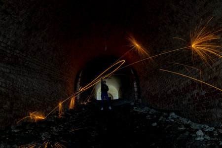 Fire Dance, Long Exposure in an Ancient Fort Tunnelの写真素材