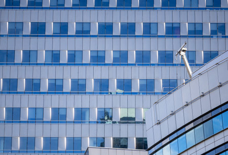 Modern glass architecture and window reflections in Warsaw