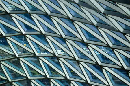 Modern glass architecture and window reflections in Warsaw
