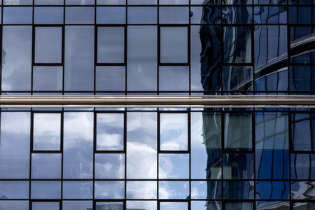 Modern glass architecture and window reflections in Warsawの写真素材