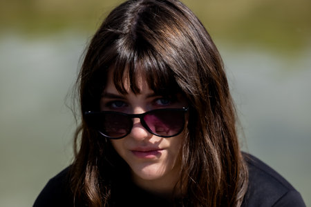Confident Young Woman in Sunglasses Portrait
