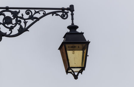 Traditional French street lanterns in old towns. Elegant metal and glass designs highlight European architecture and charm. Perfect for travel, culture, history, and city detail conceptsの写真素材