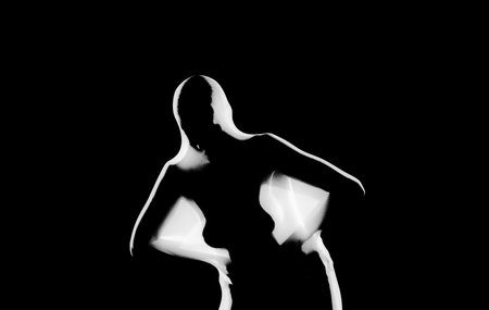 Play of Light and Shadows: Body Shapes Behind Silk Veilsの写真素材