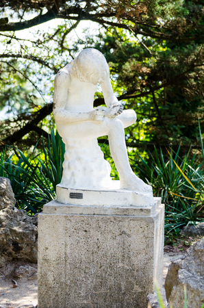 Sculpture \"Boy take out a splinter\" Nikitsky Botanical Garden. Crimea, Yalta, Nikita village.の写真素材