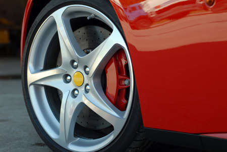 Wheel on a red sport carの写真素材