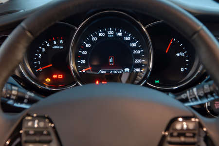 Closeup shot of a speedometer and tachometer of a modern car