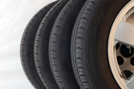 four summer tires isolated on white backgroundの写真素材