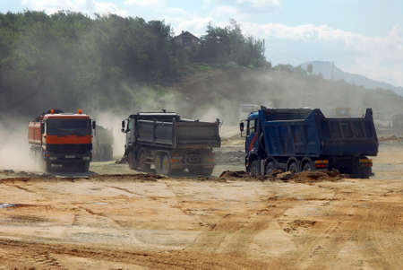 large trucks at construction siteの写真素材