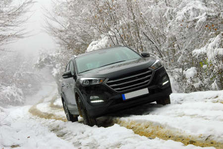 Off-road SUV in mud and snow