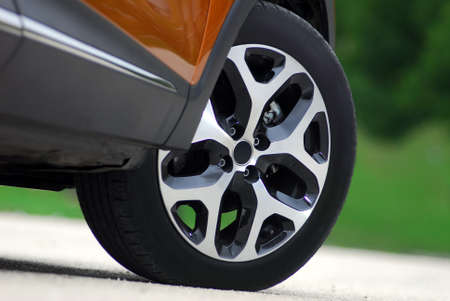 tire and aluminum alloy wheels on a passenger carの写真素材