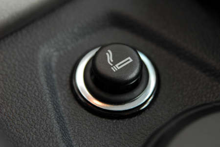 The Car cigarette lighter in a car interior