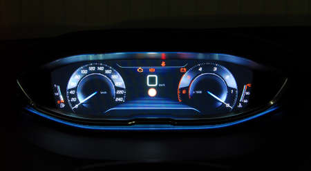 Modern car illuminated dashboard closeup