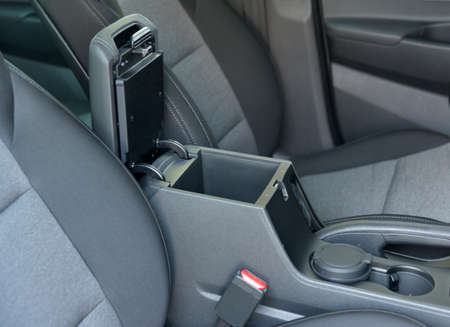 Open storage box between front car seats