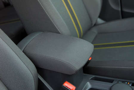 armrest in the luxury passenger car between the front seats
