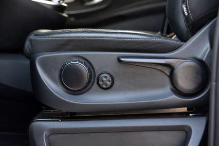 electric buttons and mechanical adjusting lever for adjusting seat positionの写真素材