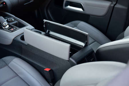 Open storage box between front car seats