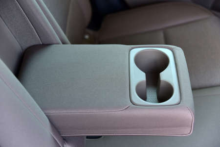 Armrest in the car with cup holder for rear seats rowの写真素材