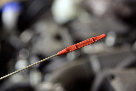Checking the oil level in the car engine