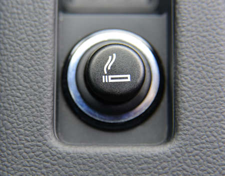 Cigarette lighter on the dashboard of a passenger car