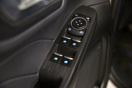 Button to control the side mirrors in the passenger car