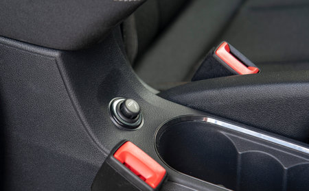 Car lighter socket on the dashboard of a passenger car.の写真素材